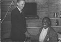 Helen's dad shaking hands with Louie Armstrong.