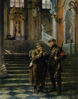 Two Soviet men in military uniform in front of the Winter Palace: the one is lighting cigar to another one.