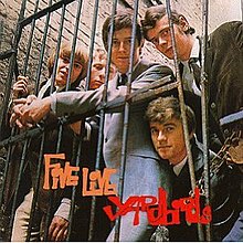 The Yardbirds, standing behind an iron gate. Clockwise from left: Keith Relf, Chris Dreja, Eric Clapton, Paul Samwell-Smith, Jim McCarty.