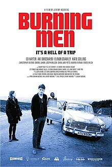 Poster for the film Burning Men featuring a desaturated image of three people standing near a vintage car on a rural road, with a dramatic, overcast sky. The film title is displayed in bold red letters at the top, with the tagline "It's a hell of a trip" below it.