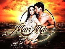 An image of Marian Rivera and Dingdong Dantes in the sea, with the sunset on the background. The series title is displayed on the center of the image.