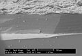 SEM image of the corrosion layer on the surface of an ancient glass fragment, note the laminar structure of the corrosion layer.