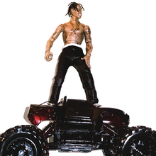 A man ressembling Travis Scott as a toy against a white background and standing atop a car