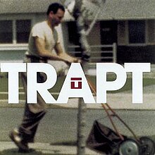 The cover features a man wearing a white t-shirt and beige pants using a lawnmower. The band's name appears over the photo, colored in white, and the band logo is featured on the 'A'.