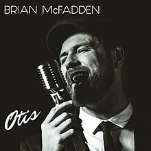 The cover is a black-and-white photo of McFadden singing into an old-fashioned microphone. The artist's name and album title appear on the top and bottom left corners of the cover, the latter written in cursive lettering.