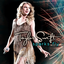 Cover artwork of "Sparks Fly", showing Taylor Swift holding a mic and wearing a fringed golden dress