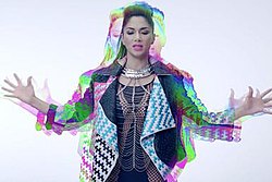 Woman wearing a leather jacket is shown with rainbow outline/shadow