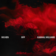 A black background with red cloud-like or flower-like shapes; the artist name, two Chinese characters and the album title are small white text.