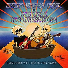 Two skeletons sit in a small boat, with the rays of the setting sun behind them. One skeleton is wearing sunglasses, a black t-shirt, and dark pants, and playing an electric guitar. The other is wearing a sleeveless t-shirt and shorts, and playing an acoustic guitar.