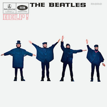 The Beatles, standing in a row and wearing blue jackets, with their arms positioned as if to spell out a word in flag semaphore – George, John, Paul and Ringo