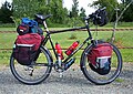 Touring bicycle with three bottle cages