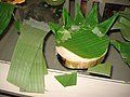 Partially made krathong, showing trunk of banana tree and banana leaves