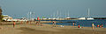 The beach with the marina in the background