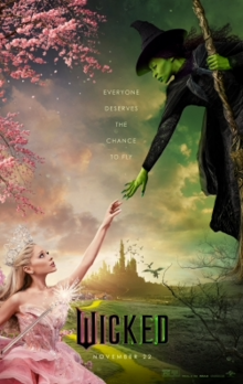 The poster mimics Michaelangelo's The Creation of Adam and is pink on the left and green on the right. Galinda is in the bottom left in a pink dress, reaching up to Elphaba, who's in the top right in a black dress, witch's hat and on a broomstick, reaching down to Galinda. In the middle, both hands are outstretched but not touching, and the film's tagline is written in white text on separate lines: "Everyone deserves a chance to fly". The landscape of the Land of Oz is in the background.