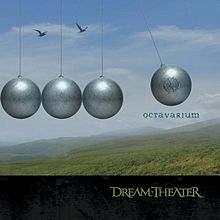 alt=Four grey balls make up half of a giant Newton's Cradle. The ball on the right is midway through a swing and has the Majesty symbol on it. The word "Octavarium" is written under this ball. Two birds fly above the stationary balls. The background is a set of green hills with a blue, partially cloudy sky. Along the bottom of the image is a dark strip with "Dream Theater" written in the traditional Dream Theater font to the right. The front of the jacket (also the front of the case when folded out) reveals a full Newton's Cradle with 8 balls. This physics toy always repeats the same motion over and over again, emphasizing this album's theme. There are also 5 birds in the picture, forming a piano octave - the balls being the white keys and the birds being the black keys. This theme of octaves and moving in circles is continued throughout the entire album. On the back of the jacket, you'll see part of a piano. Note that each octave on a piano has 8 white keys and 5 black keys. Each white key represents a song off the album - in order, starting with F. In fact, these notes are the minors of the key the song is in. If you look carefully you'll see that the track times on the back of the CD appear to be incorrect. They only add up to 73:26, when any CD player will tell you that the CD is 75:55. Interestingly enough, 5 of the tracks have negative time that makes up the missing 2:18. Not only do each of these negative time tracks represent the accidental, but they are also in the key of the relative minor of the accidental. - 0:00 - 8:07: The Root Of All Evil F - 8:08 - 8:25: Nature Sounds (Negative Time) F# - 0:00 - 5:20: The Answer Lies Within G - 5:21 - 5:33: Pitch Bend (Negative Time) G# - 0:00 - 6:59: These Walls A - 7:00 - 7:36: Wind/Heartbeat/Chimes (Negative Time) A# - 0:00 - 4:29: I Walk Beside You B - 0:00 - 7:16: Panic Attack C - 7:17 - 8:13: Synth Solo (Negative Time) C# - 0:00 - 6:33: Never Enough D - 6:34 - 6:46: Voices Begin (Negative Time) D# - 0:00 - 10:42: Sacrificed Sons E - 0:00 - 24:00: Octavarium F (Octave)